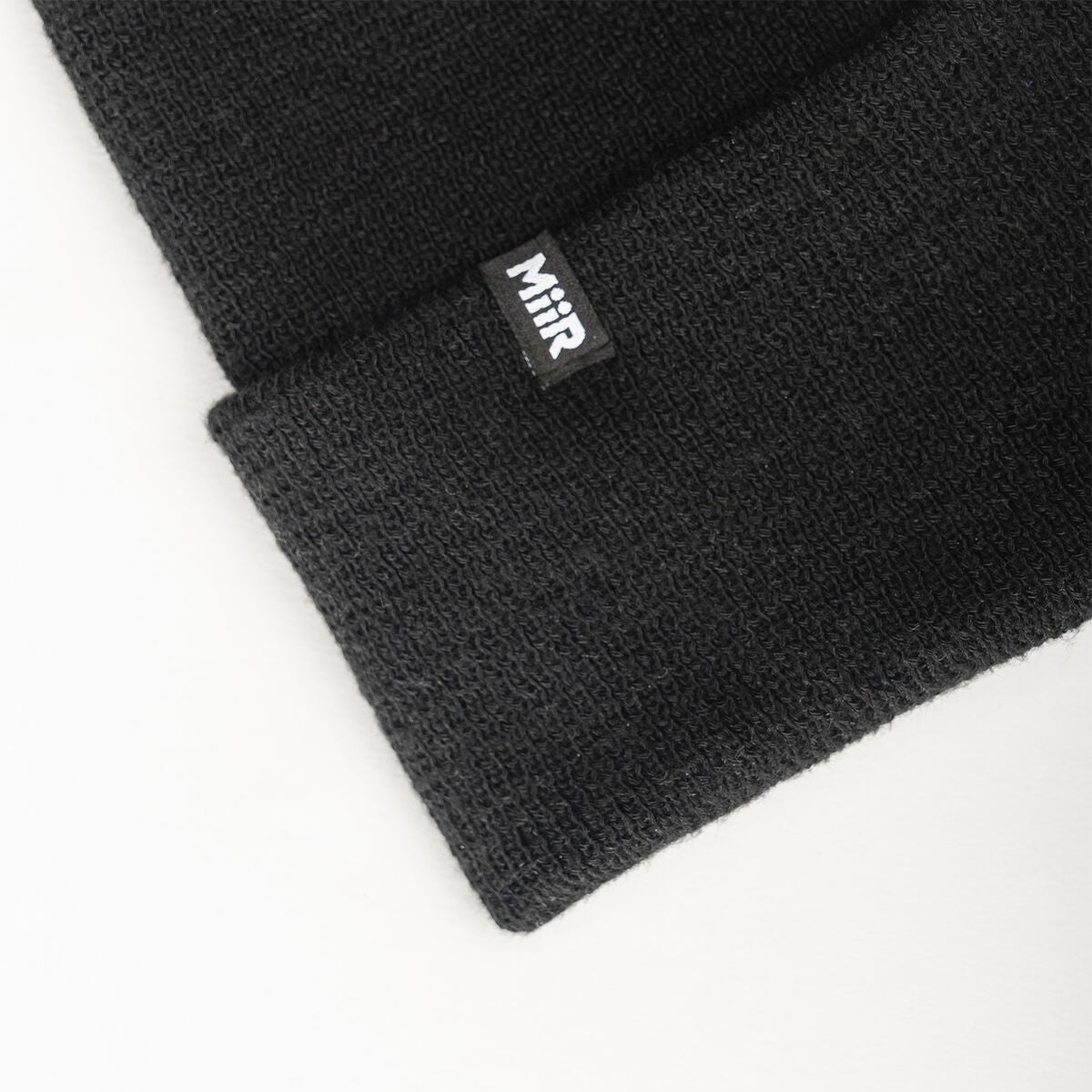 recycled-poly-fine-knit-beanie-g7 WebPDP-RecycledPolyFineKnitBeanie_Studio_TagDetail_Black__BNE005002OS.jpg